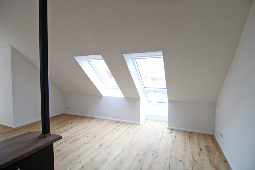 Wohnzimmer mit offener Küche